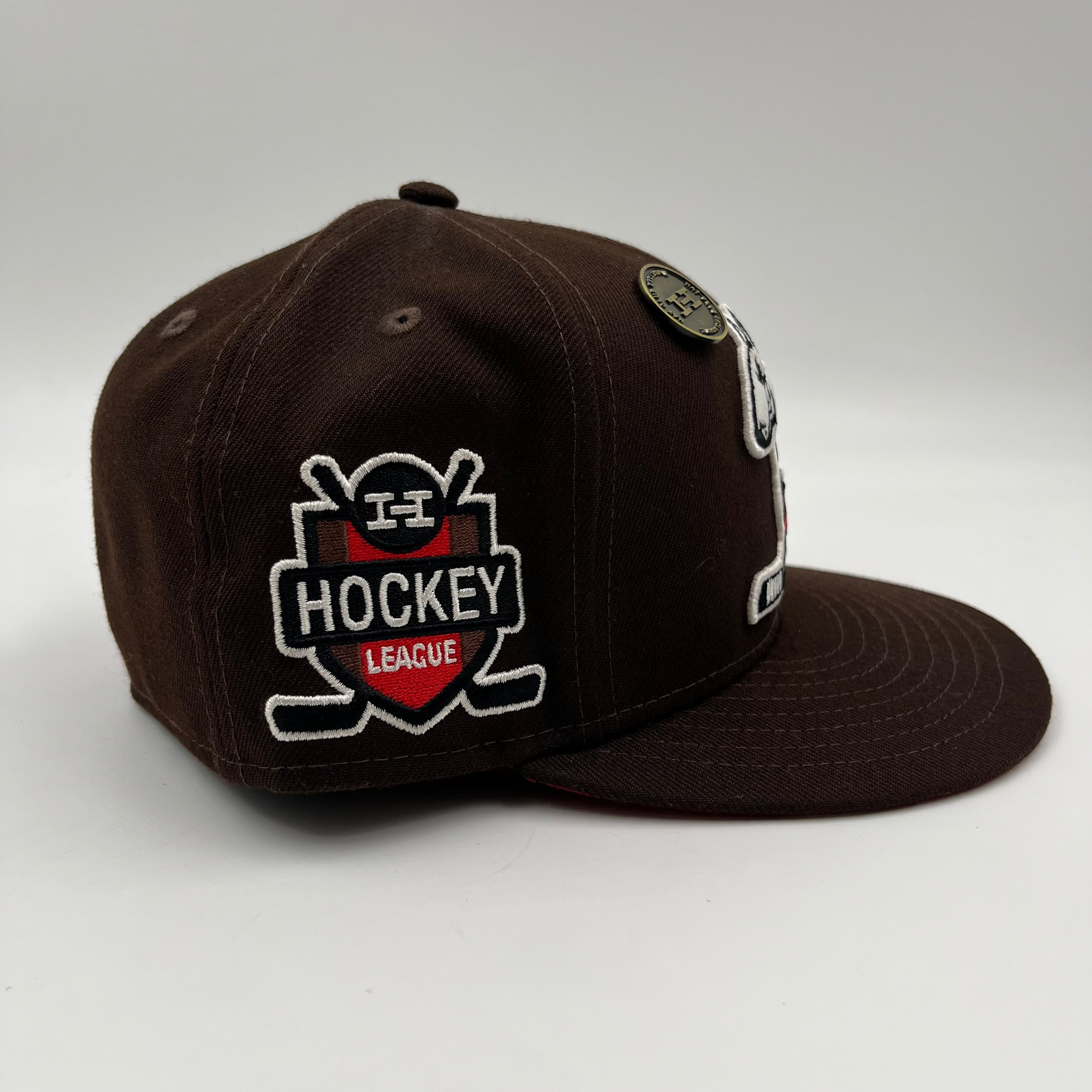 New Era 59Fifty fitted hat featuring an embroidered cartoon bulldog playing ice hockey Hat Club Exclusive