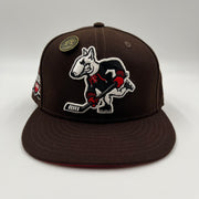 New Era 59Fifty fitted hat featuring an embroidered cartoon bulldog playing ice hockey Hat Club Exclusive