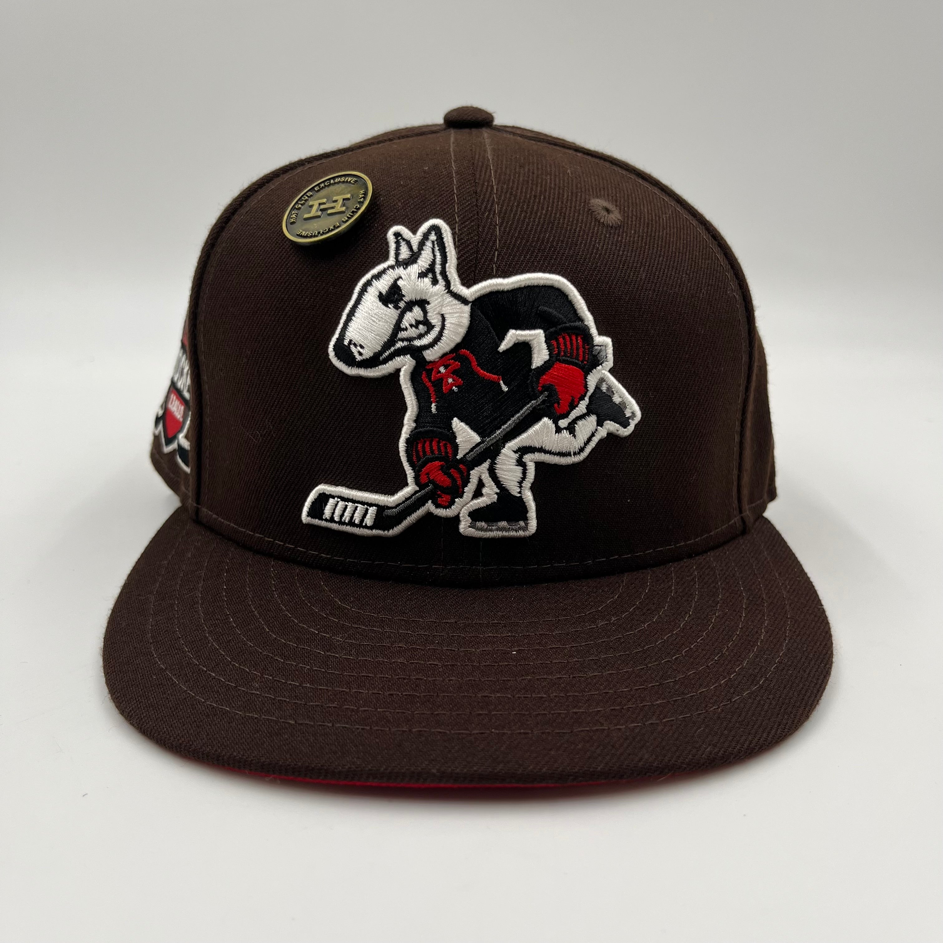 New Era 59Fifty fitted hat featuring an embroidered cartoon bulldog playing ice hockey Hat Club Exclusive